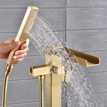 Freestanding Floor Mount Single Handle Waterfall Tub Filler Faucet with Handheld Shower in Brushed Gold